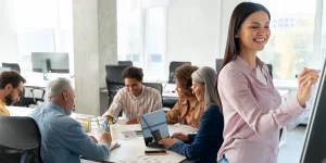 Startup team welcoming new hire from tech layoffs — startup hiring opportunity