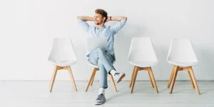 College graduate highlighting key skills on resume — what employers want from new grads