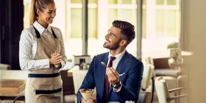 Hospitality workers in hotel lobby representing US leisure industry job growth