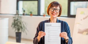 Professional writing ATS-friendly resume on laptop — ATS resume optimization guide 2023