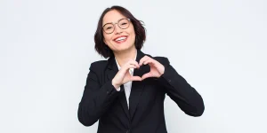 Happy client holding job offer after using Resume Mansion professional resume service