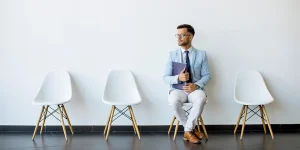 Professional preparing answers before job interview — essential interview questions to practice