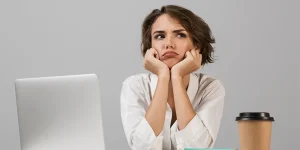 Professional working at a desk revamping their resume — how to fast-track your stalled job search with a resume revamp