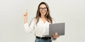 Professional writing a standout resume at desk — resume writing best practices for job market success