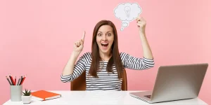 Excited professional celebrating landing a job after boosting resume — boost resume land new job