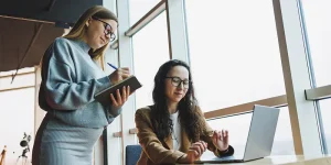 Professional rewriting their resume at a desk for a new career position — rewrite resume new position