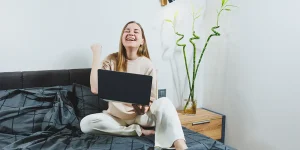 Graduate writing on notepad at desk — how to write a CV with no experience