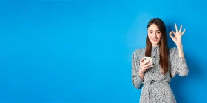 Professional using smartphone and laptop for social media career growth — elevate career social media