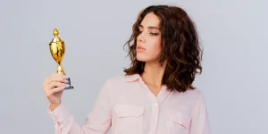 Professional holding trophy showcasing career achievements — professional achievements resume