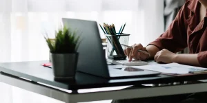 Professional reviewing resume with red pen marking errors — common resume pitfalls