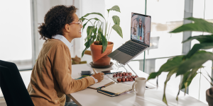 Person working remotely on laptop from home office — remote work experience resume