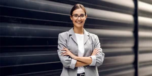 Professional setting career growth goals at desk with notebook — professional growth career