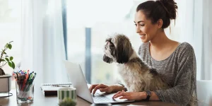 Happy professional celebrating landing dream job with resume in hand — land dream job resume tips