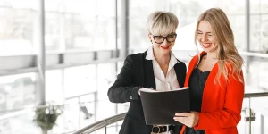 Job seeker reviewing winning resume document on desk — create winning resume job search