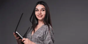 Professional woman optimizing LinkedIn profile — How to Optimize Your LinkedIn Profile to Attract Recruiters