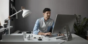 Professional optimizing resume with keywords on laptop — How to Use Keywords Effectively in Your Resume to Land More Job Interviews