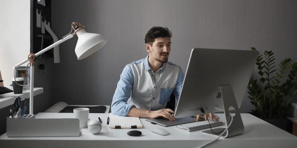 Professional optimizing resume with keywords on laptop — How to Use Keywords Effectively in Your Resume to Land More Job Interviews