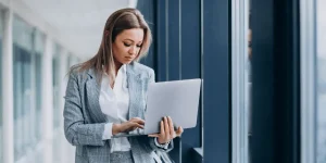 Professional reviewing a laptop checklist before applying for a job — 12 things to do before applying for a job