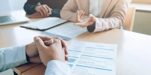 Person reviewing a resume document on a table — what is a resume and how to write one