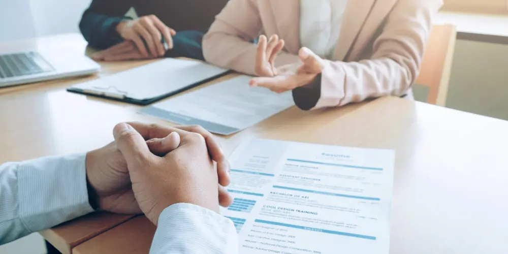 Person reviewing a resume document on a table — what is a resume and how to write one